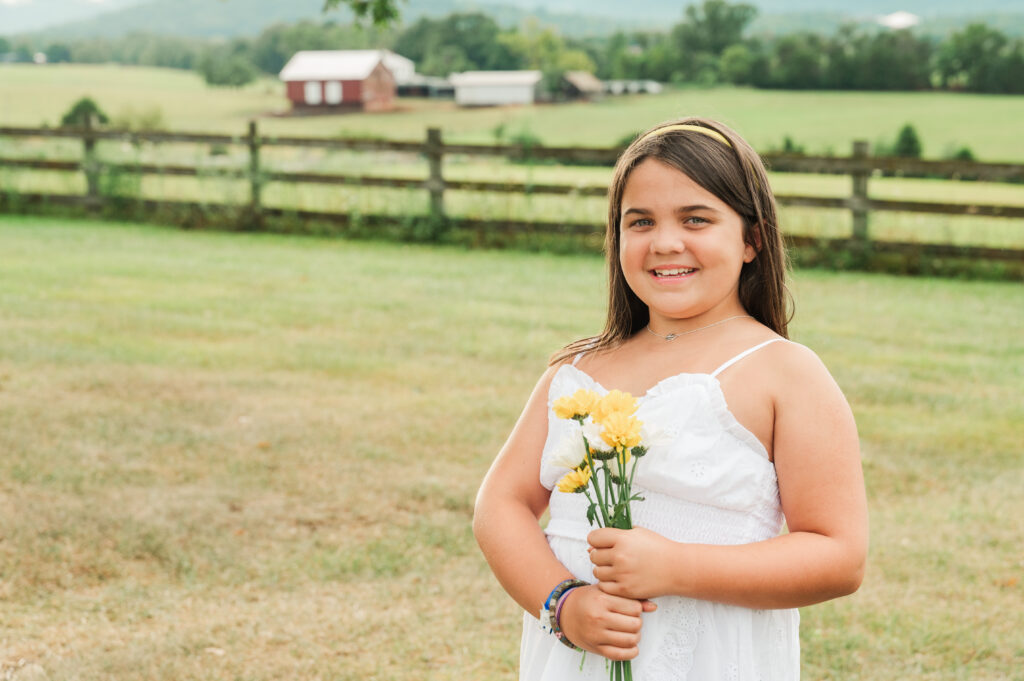 granddaughter holding daisies - Blue Ridge Mountains