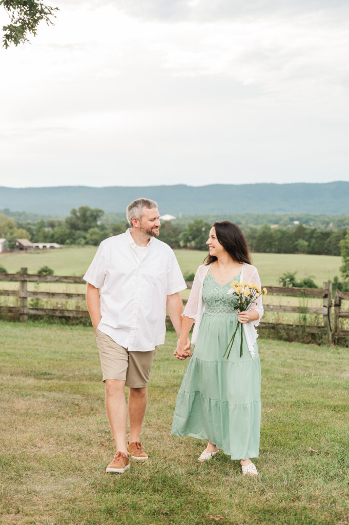 parents walking toward lens with Blue Ridge Mountain views
