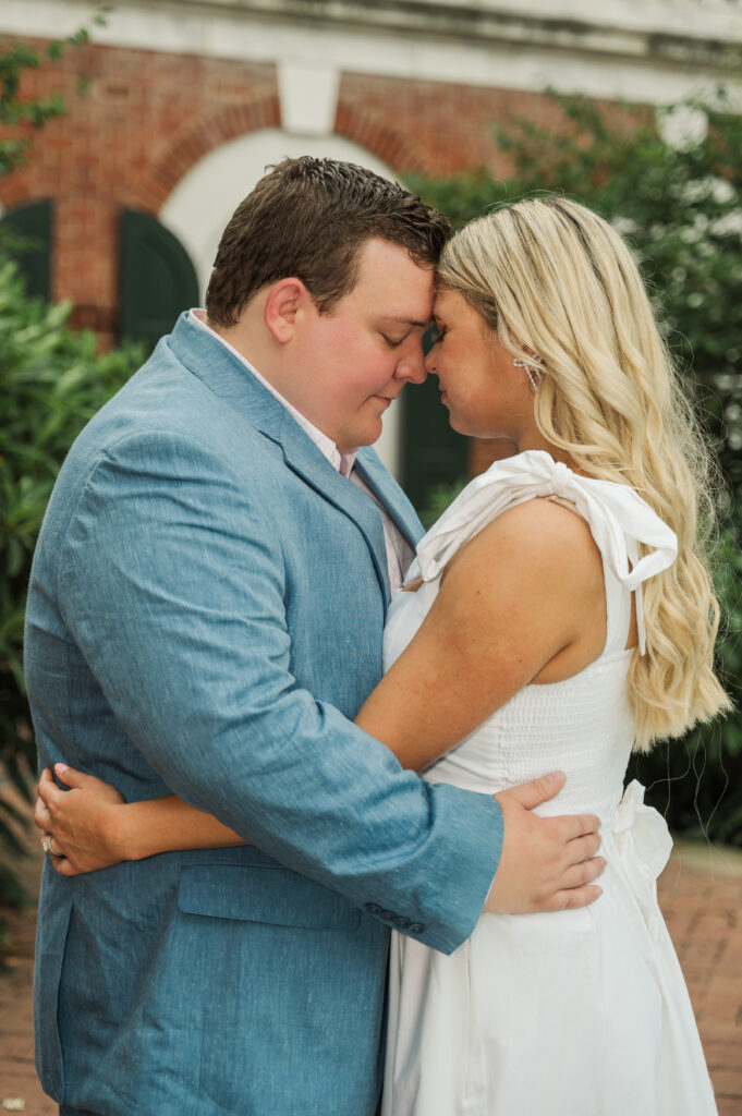 Micheala and Wade resting together forehead to forehead