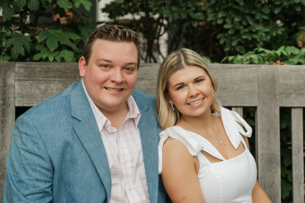 close up of Micheala and Wade sitting on bench in the East Courtyard at the Rotunda