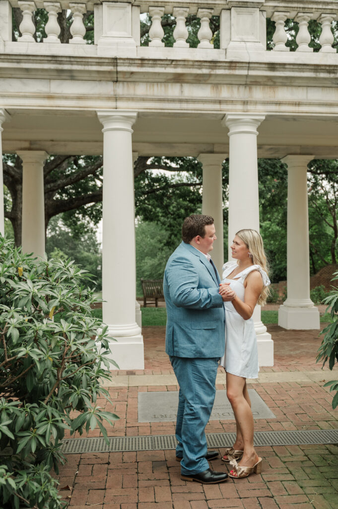 micheala and wade dancing in front of white columns at University of Virginia