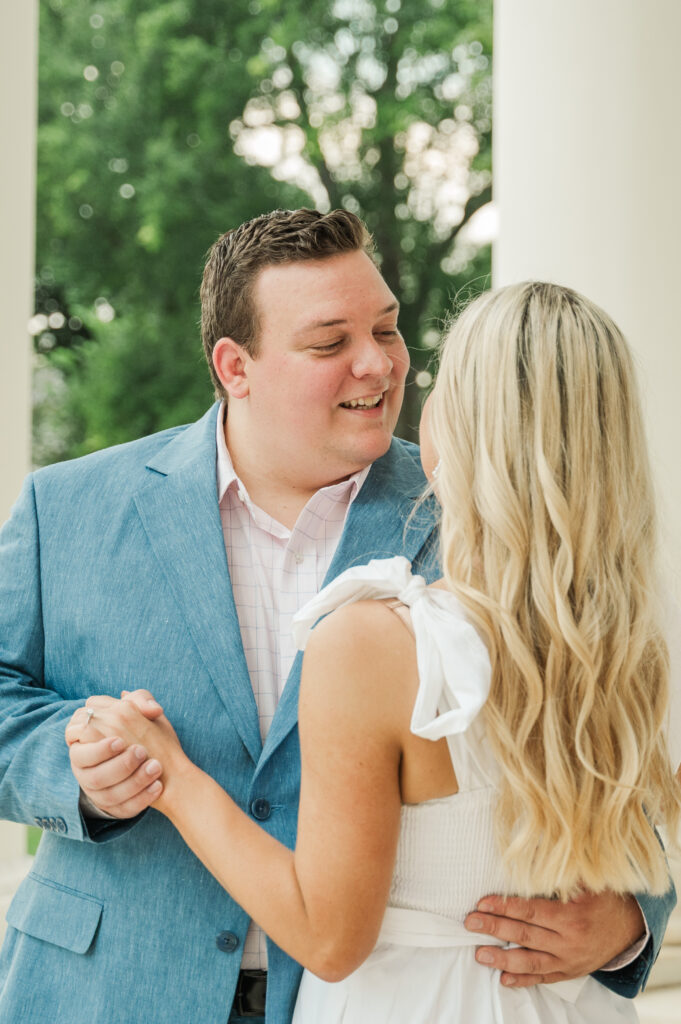 Close of Wade dancing with Micheala under the portico at the UVA Rotunda