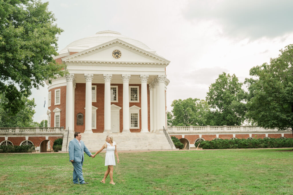 Micheala & Wade walking on Lawn in front of Rotunda