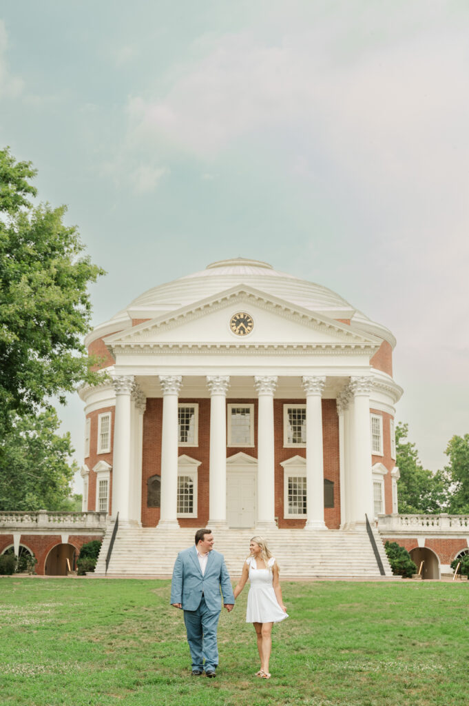 wade and michaela walking in front of Lawn at UVA