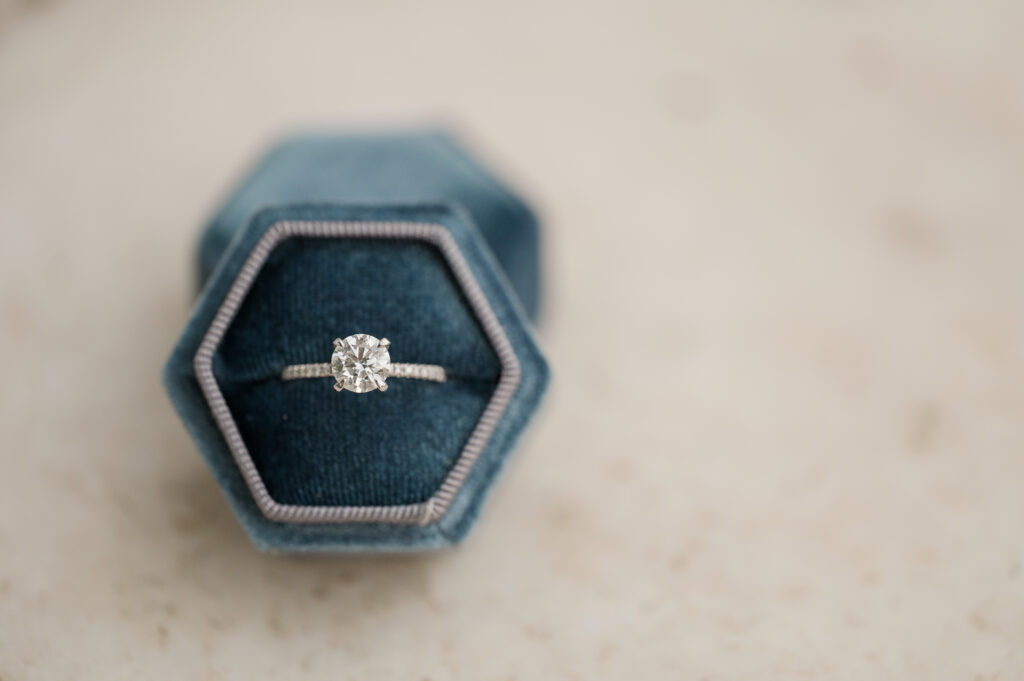 close up of engagement ring in Mrs box