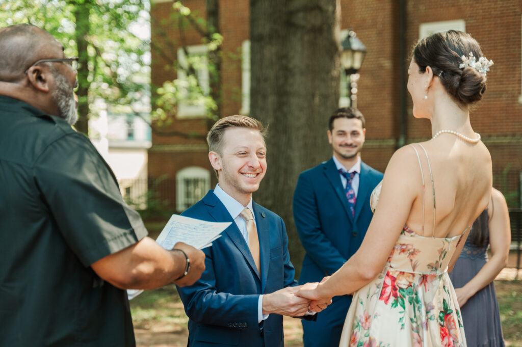 couple laughing with officiant