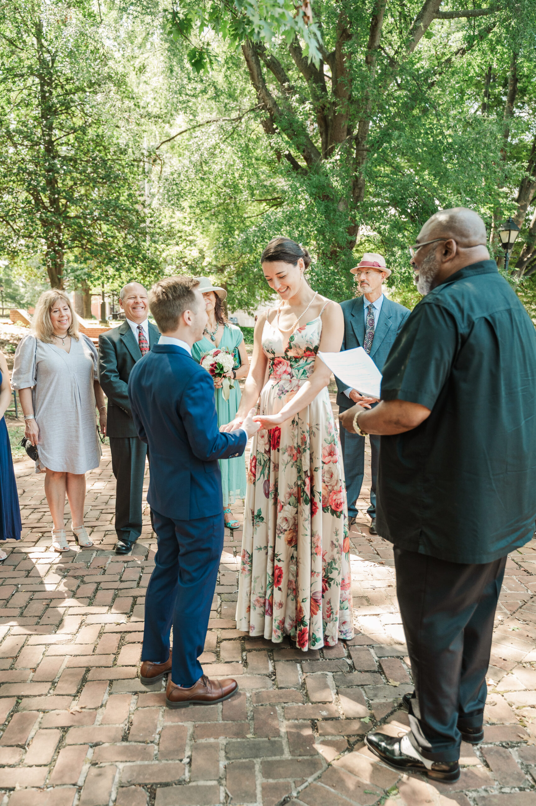 couple holding hands during elopement ceremony