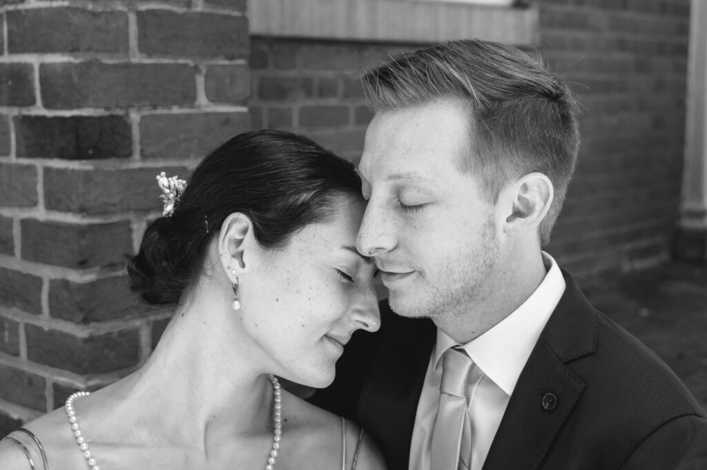 close up of couple nuzzling with each other during wedding portraits