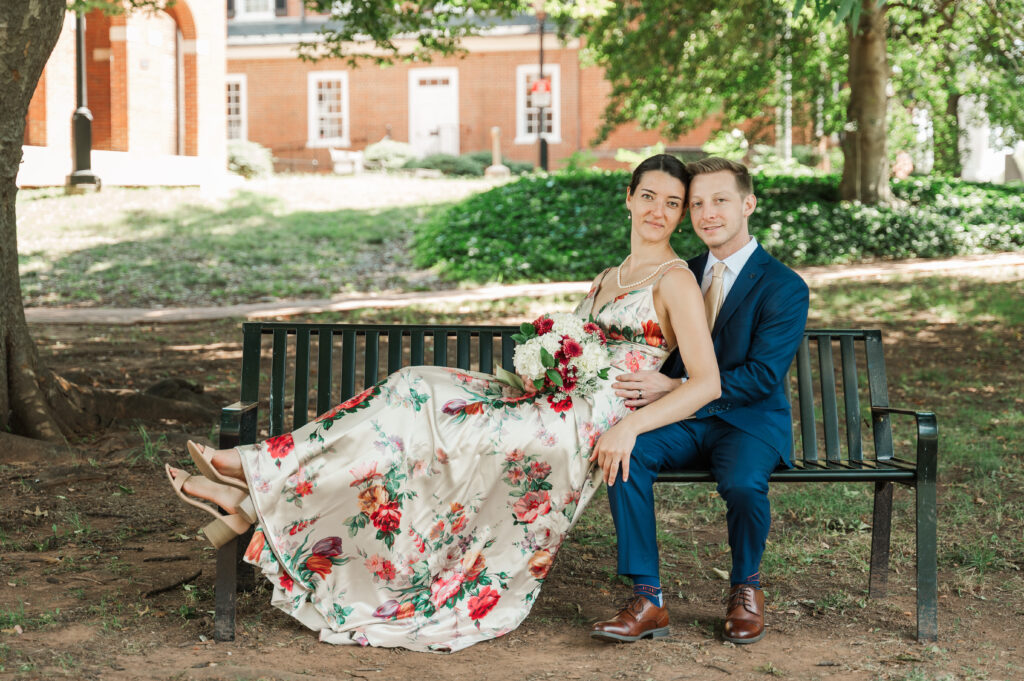 sarah leaning against Nicholas during couple's portrait session after wedding