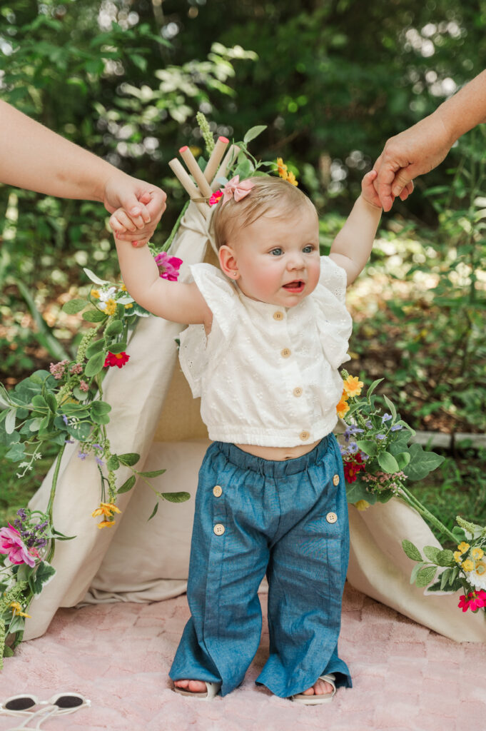 Teagan holding G Momma and Salim's hands