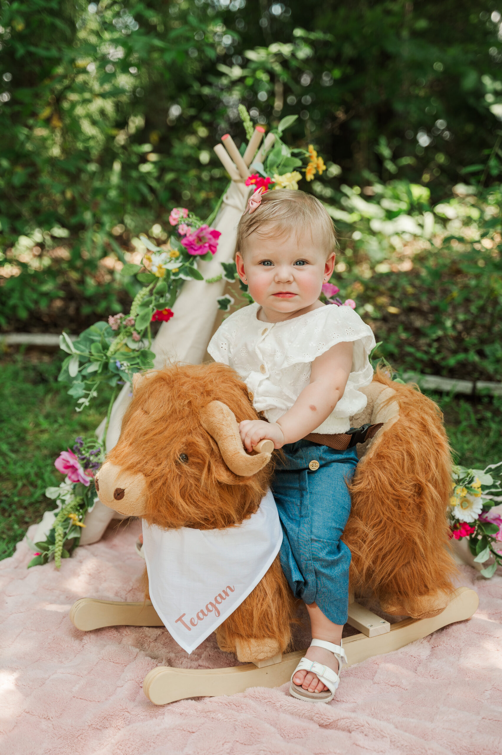 Teagan riding rocking cow