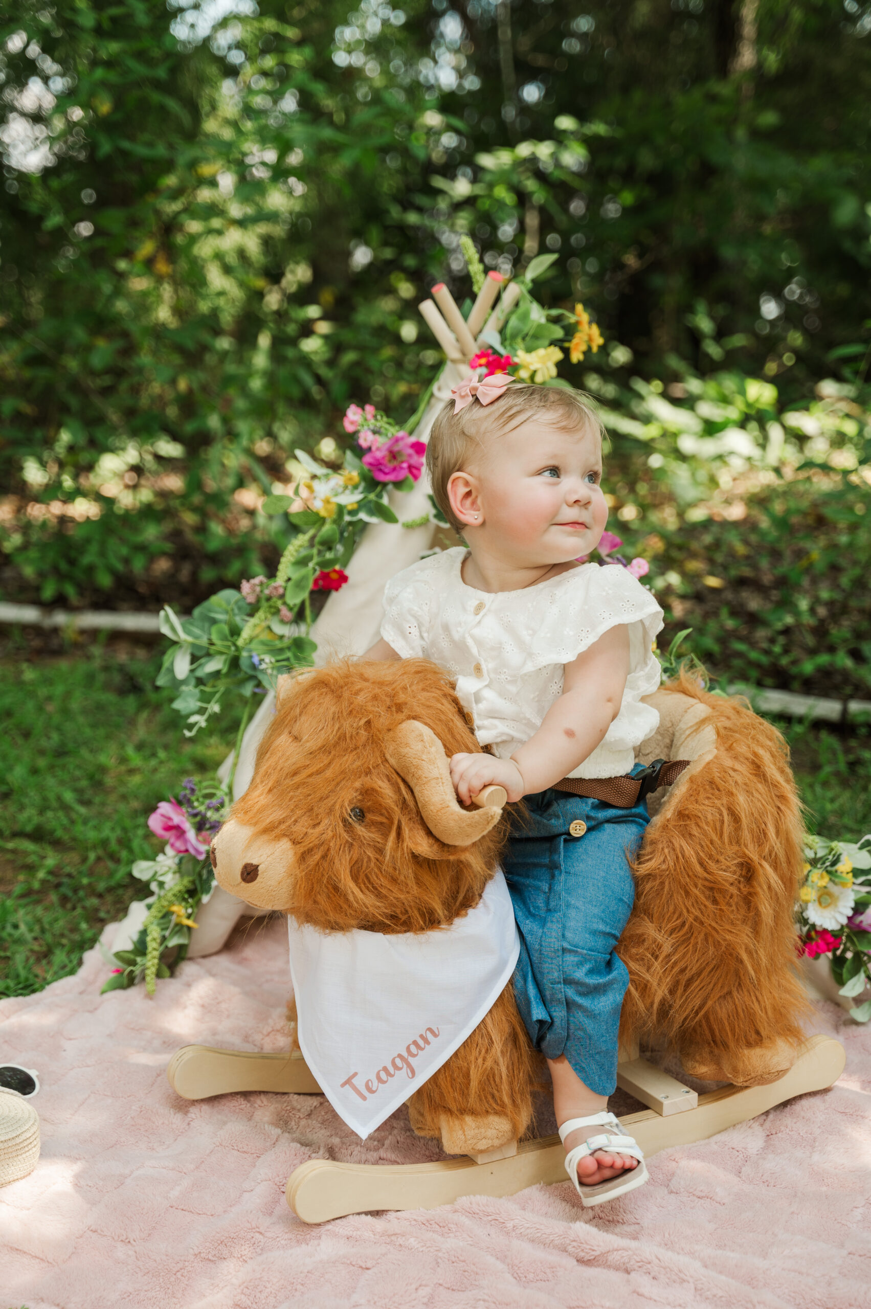 Teagan riding her rocking cow