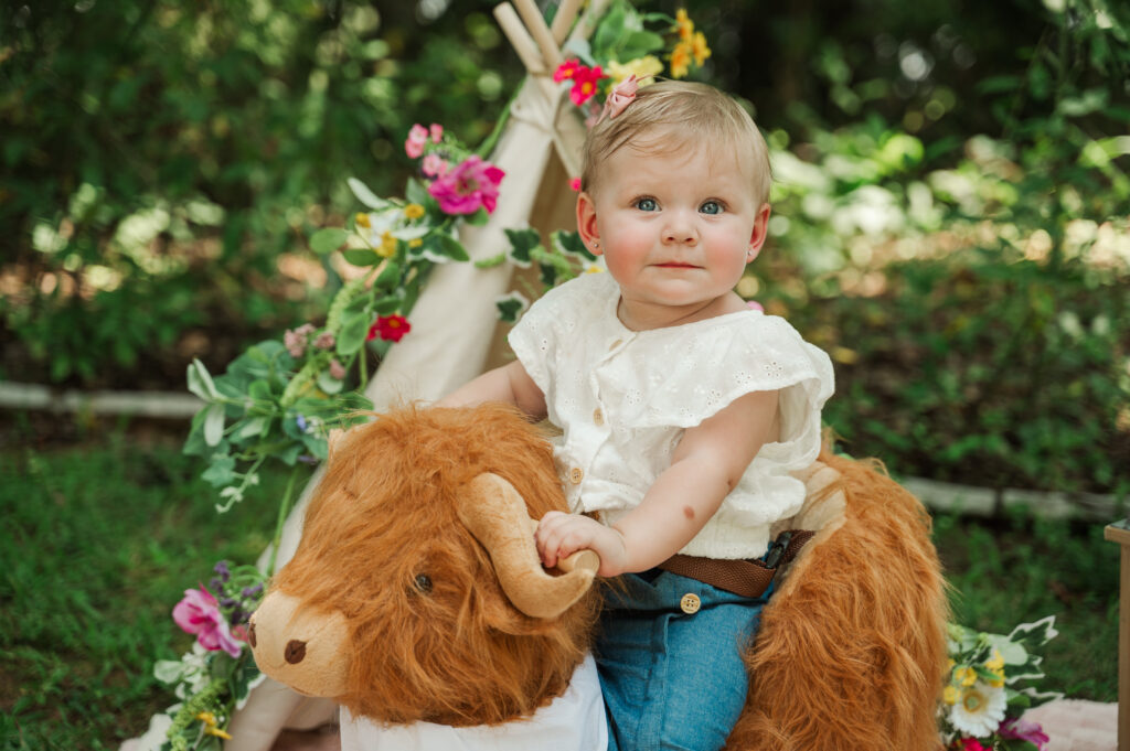 Teagan riding her rocking cow