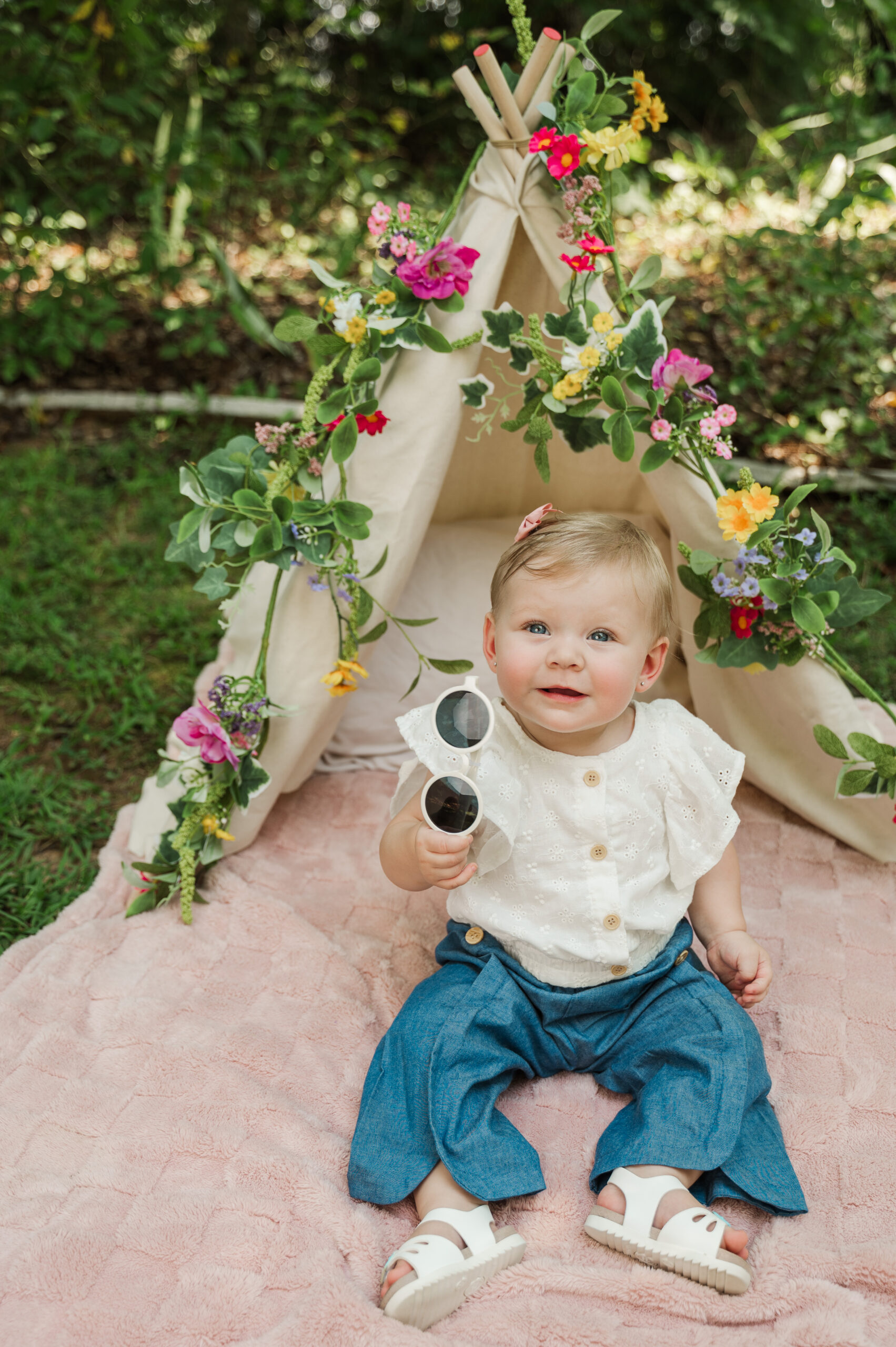 Teagan holding sunglasses