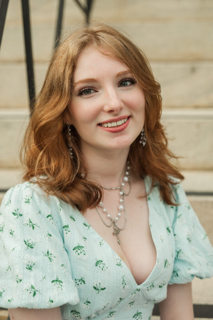 Headshot of Raichyl sitting on the steps