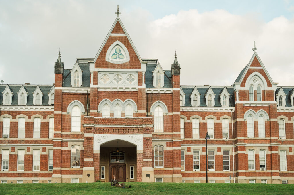 Raichyl sitting in front of the Miller School of Albemarle