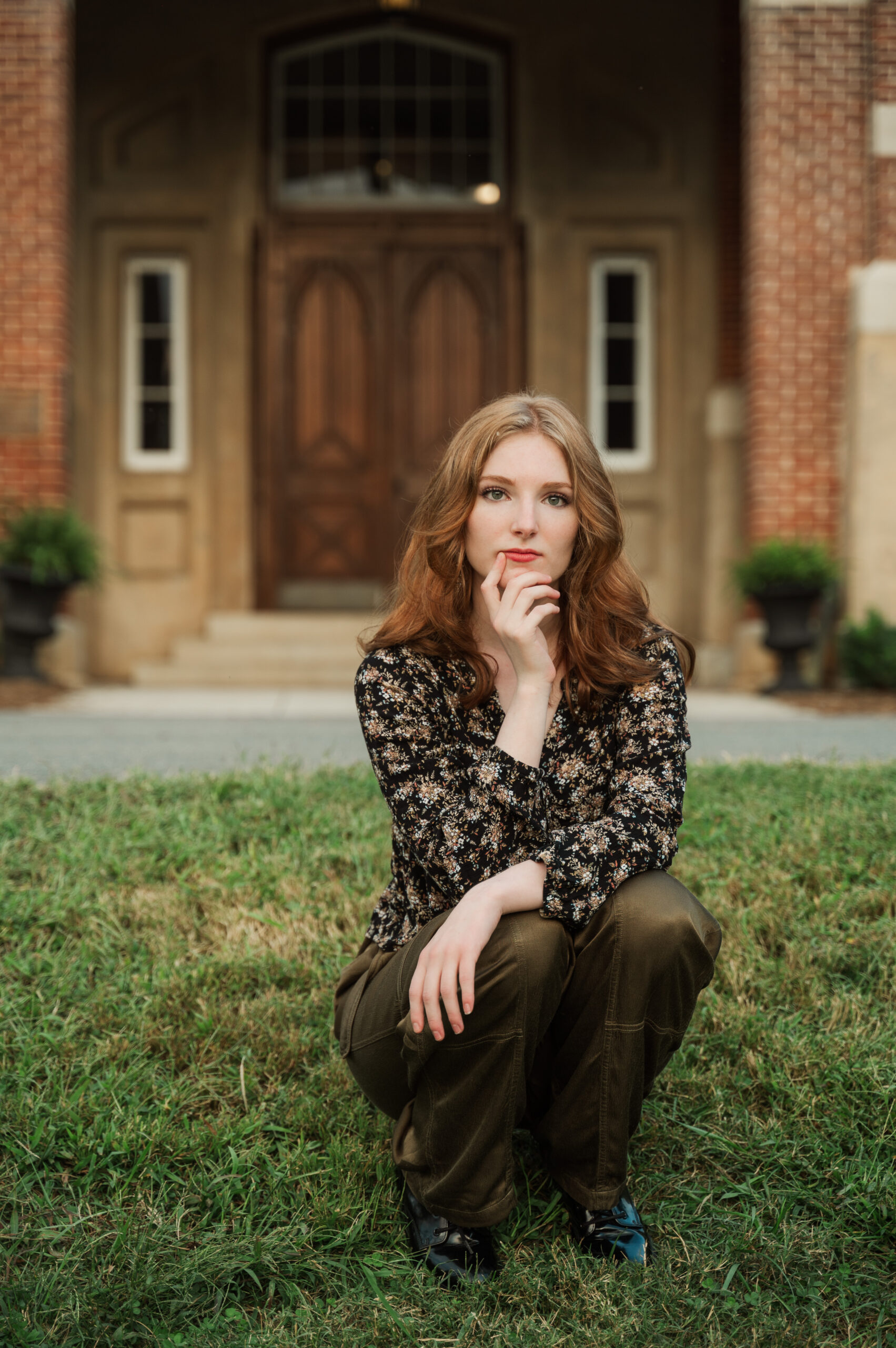 Raichyl squatting in front of the entrance at Miller School, Charlottesville, Virginia