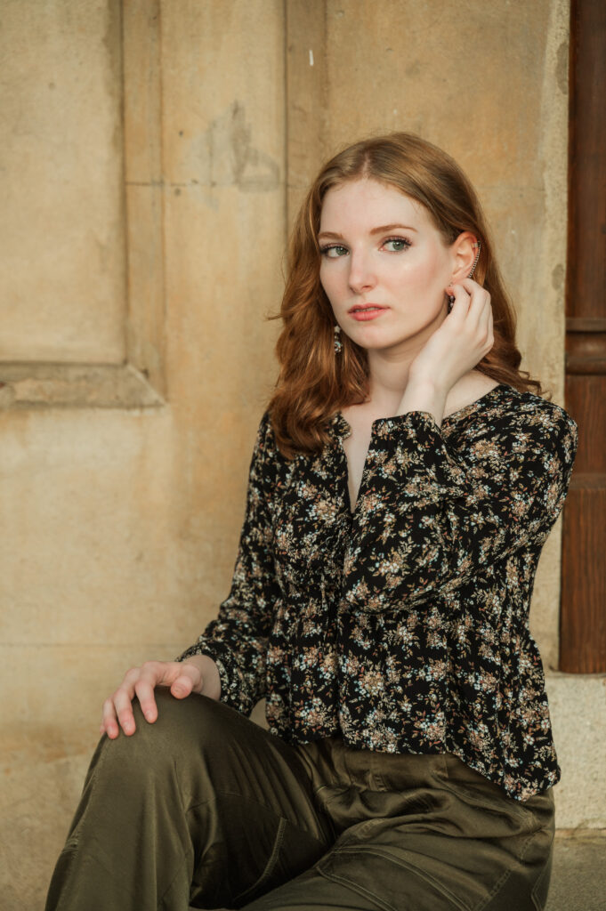 Raichyl sitting on the steps at Miller School Entrance