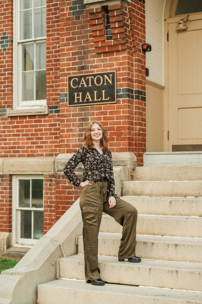 Raichyl standing on the steps of Caton Hall at Miller School of Albemarle