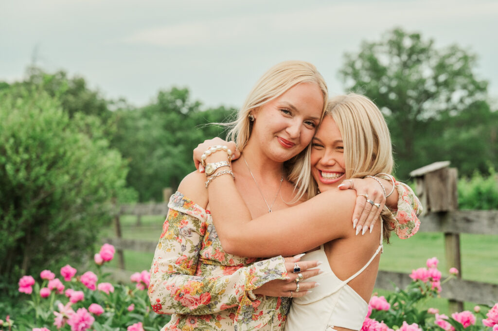 Sisters hugging at grauation party