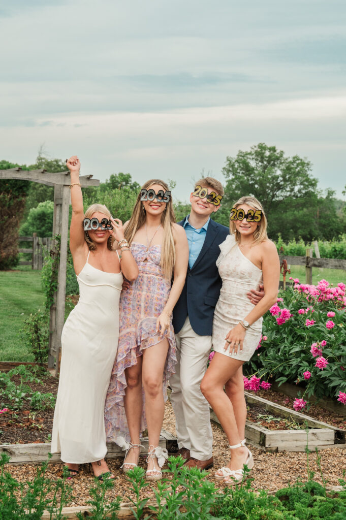 UVA graduates posing with 2025 glasses