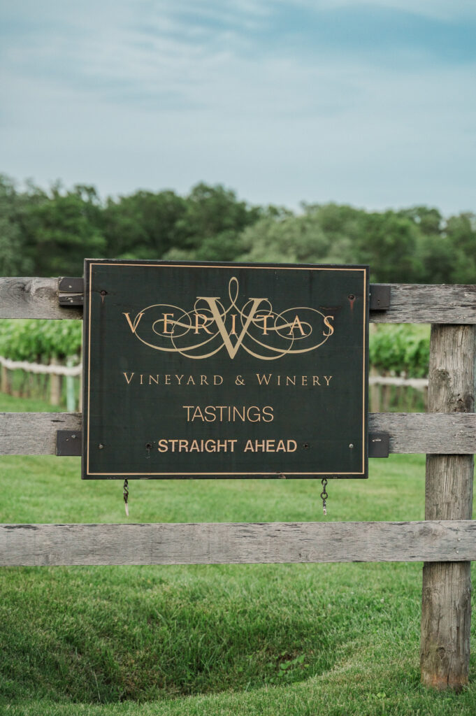 vertias sign with vines in the background