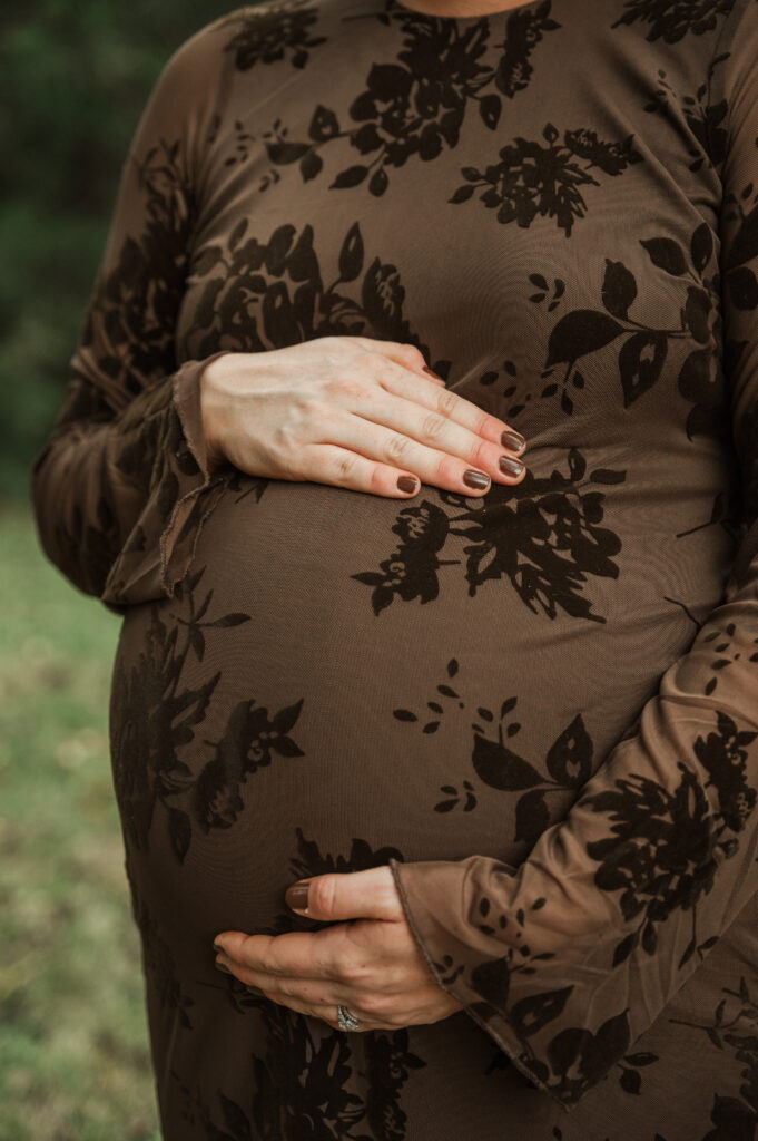 Close up of Emily's hand on her bump