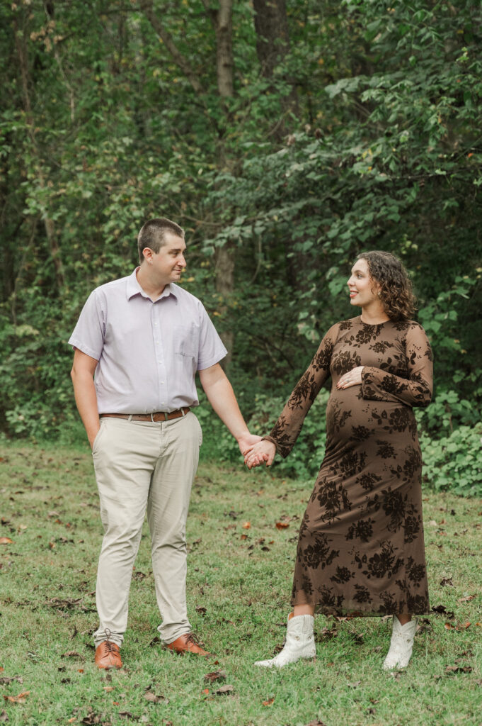 September maternity portrait on a cloudy day at Saunders-Monticello Trail with pregnant Emily and her husband Derek