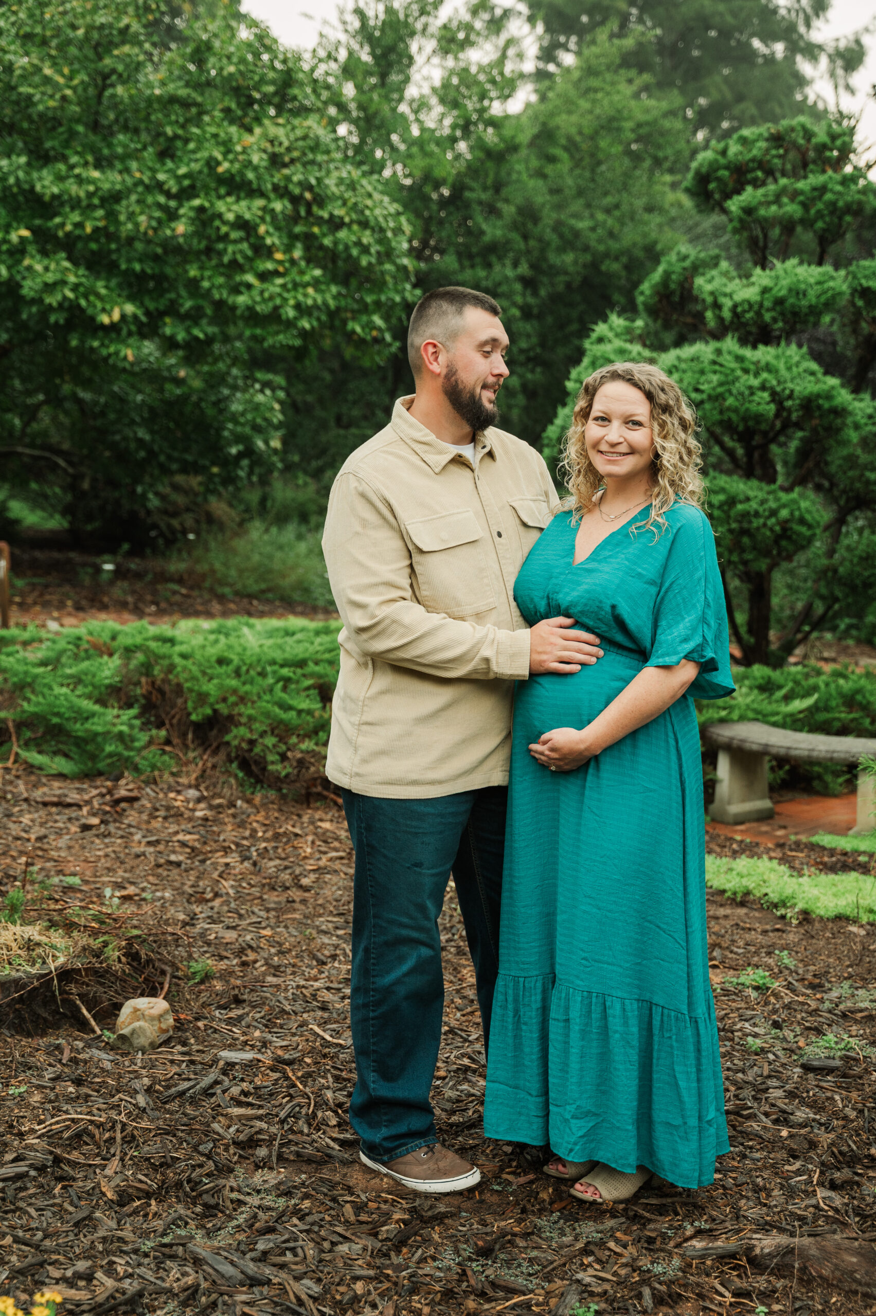 Scenic park landscape with maternity couple at Tanglewood Park near Winston-Salem.