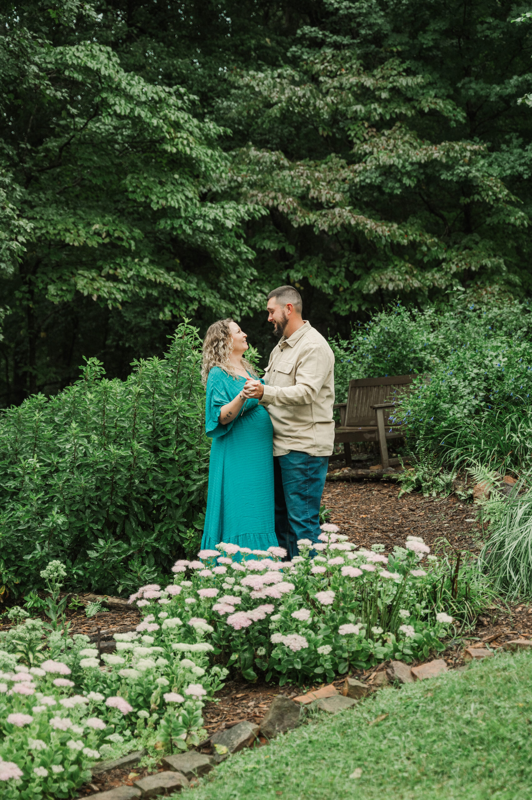 Maternity couple dancing during their session