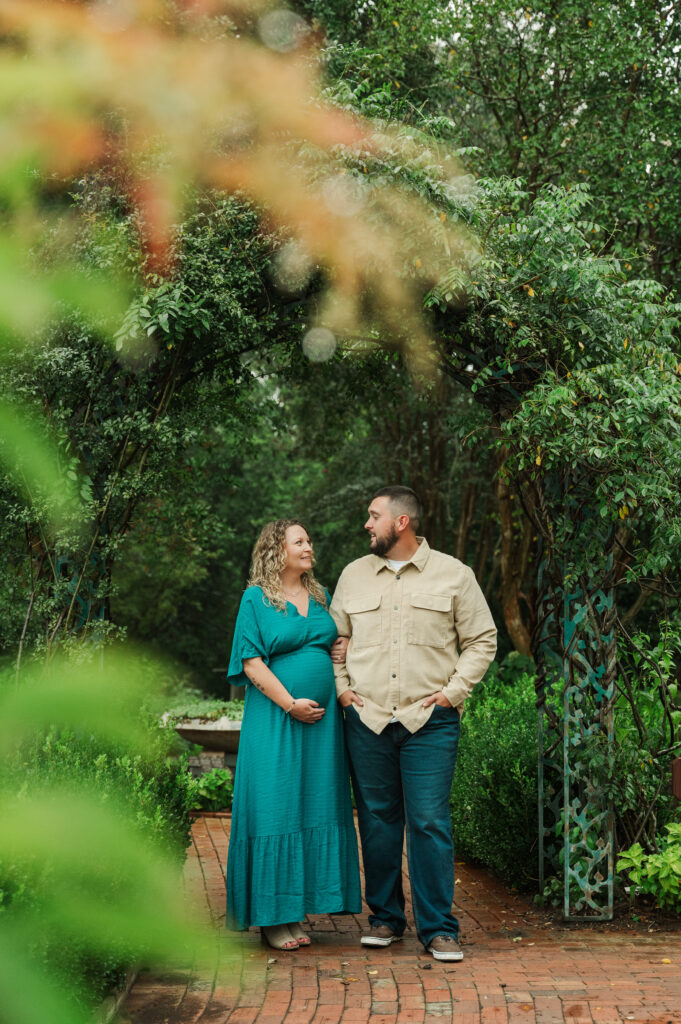 Moody overcast maternity photography at Tanglewood Park under stormy skies.