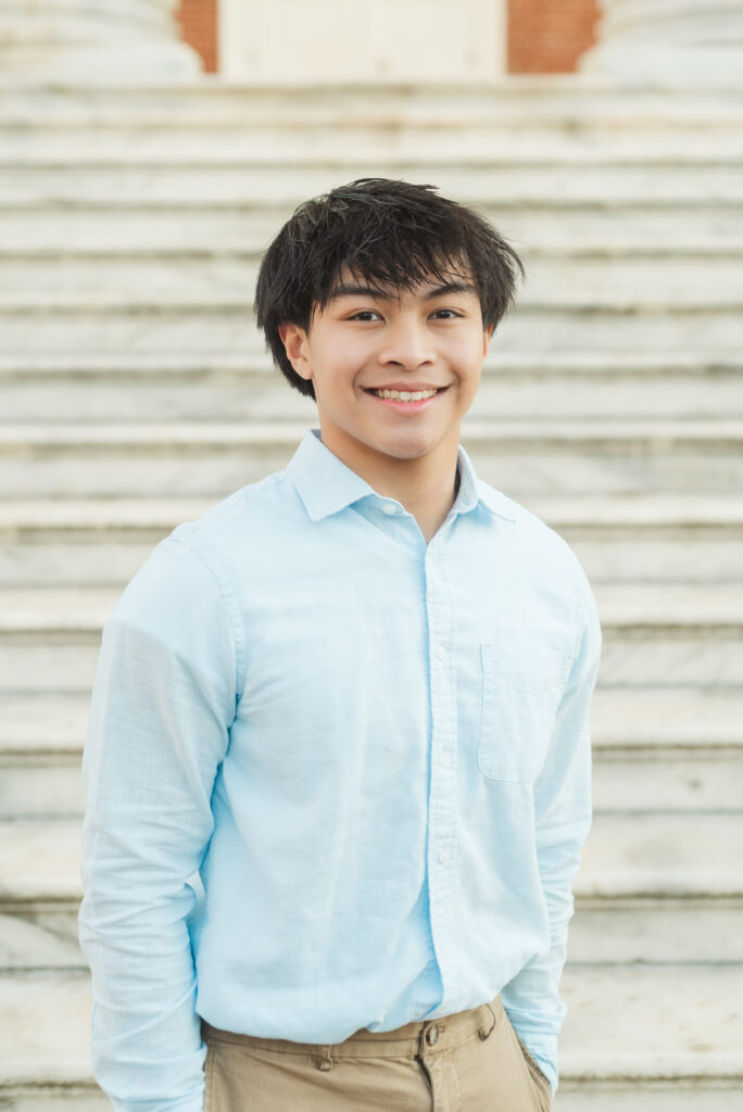 senior standing at the Rotunda steps