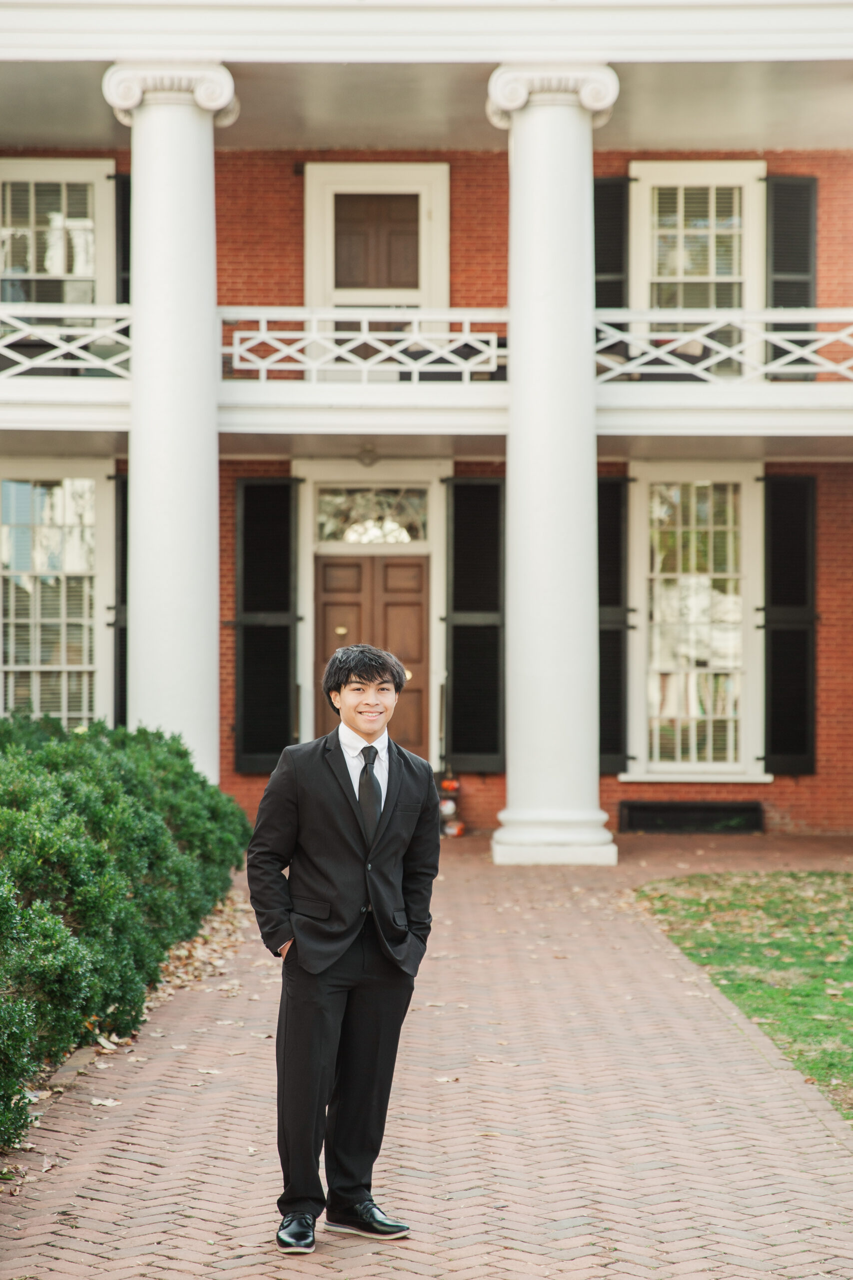 Senior standing in front of Pavilion II on the Lawn UVA