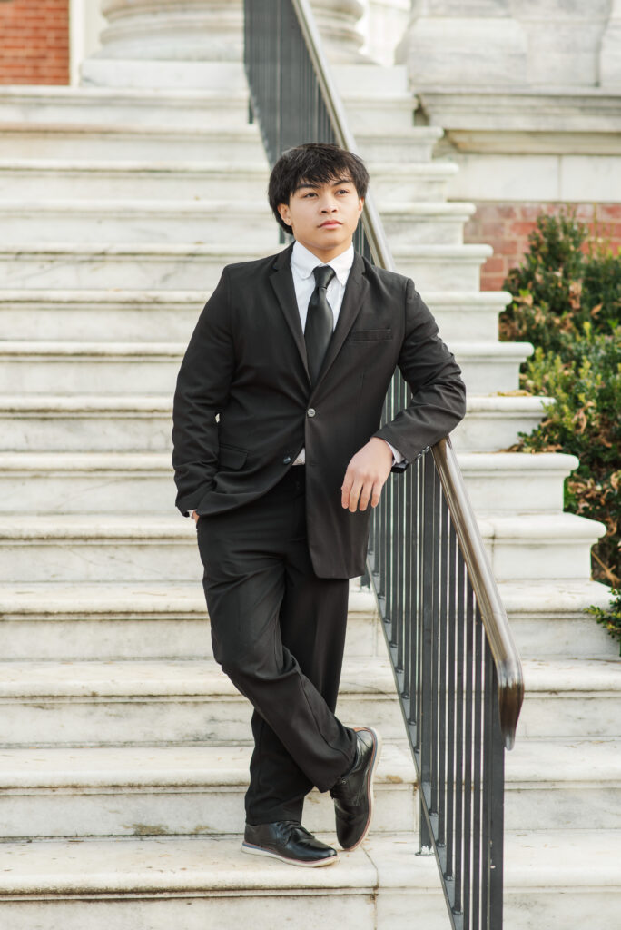 William Monroe High School senior boy standing on steps at University of Virginia