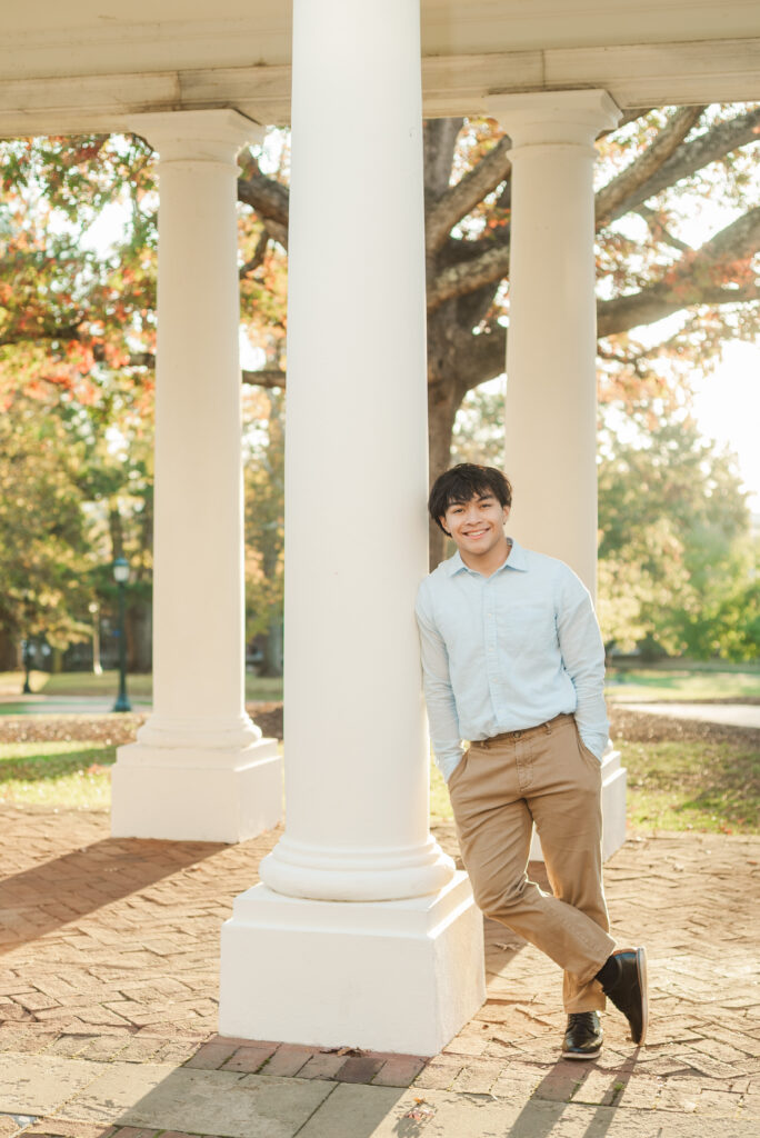 Senior leaning against column at University of Virginia