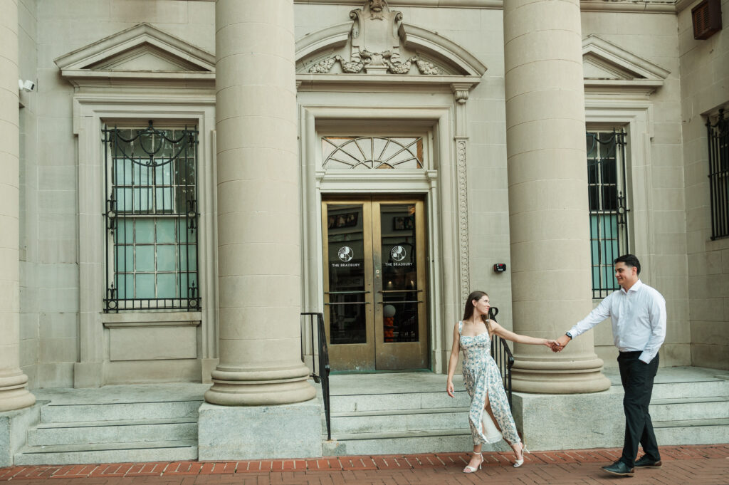 couple walking in front of the Bradbury