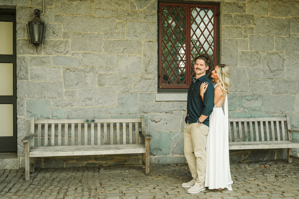 engaged couple with stone architecture