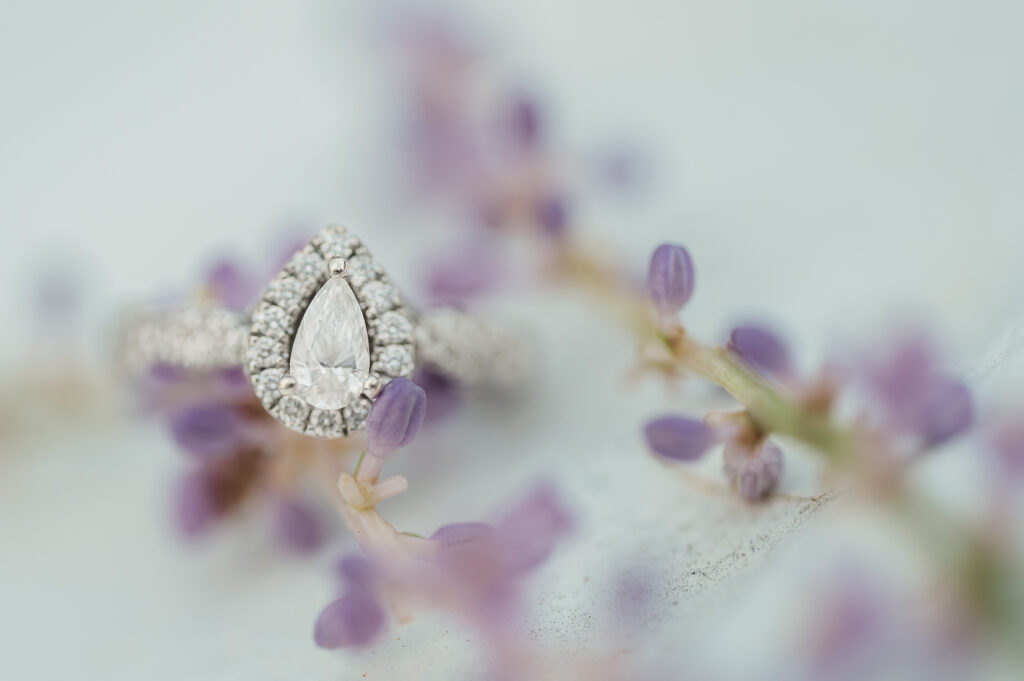 engagement ring with tiny purple flowers