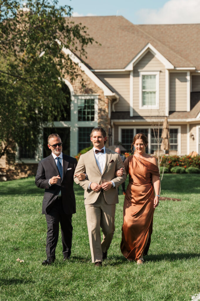 Ian's parents walking him down the aisle