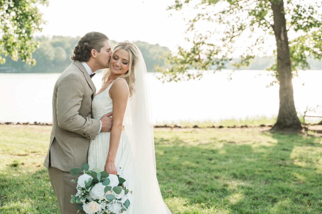 groom kissing bride's temple at Seay Point