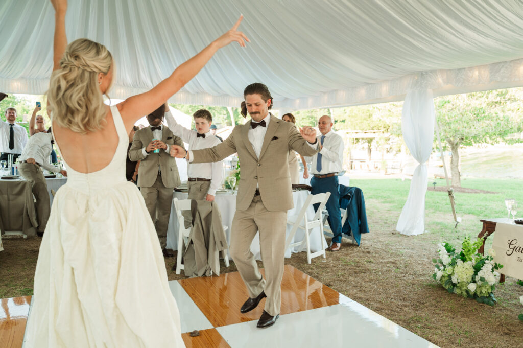bride and groom celebrating at reception