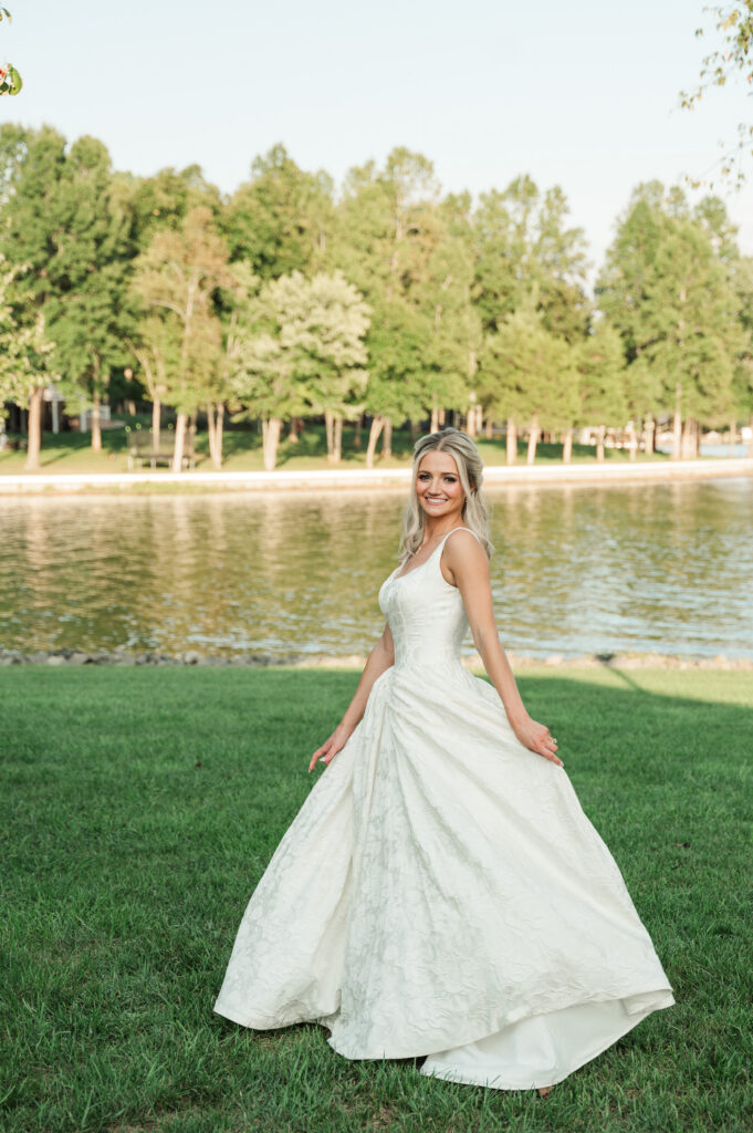 bride swishing dress lakeside