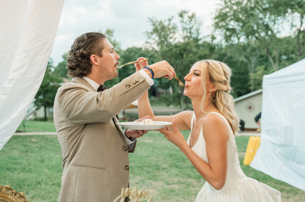 couple feeding each other cake