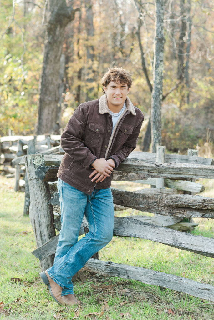 Nicholas leaning on fence at Humpback Rocks Visitor Center