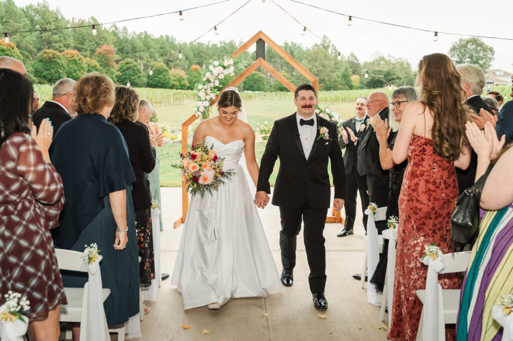 bride and groom during recessional