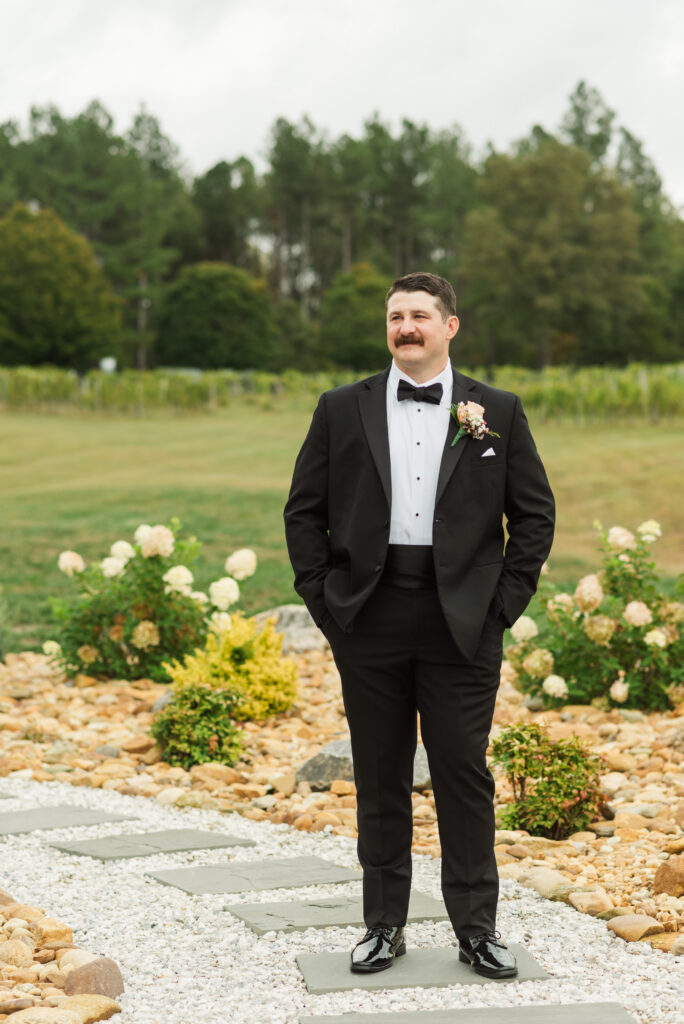 groom's portrait in garden at Hardware Hills Vineyard